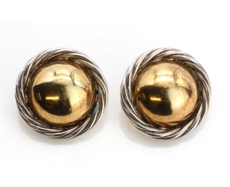 A pair of sterling silver and 18ct gold earrings, by Tinsley and Co. with a gold domed centre with a silver twisted wire bord