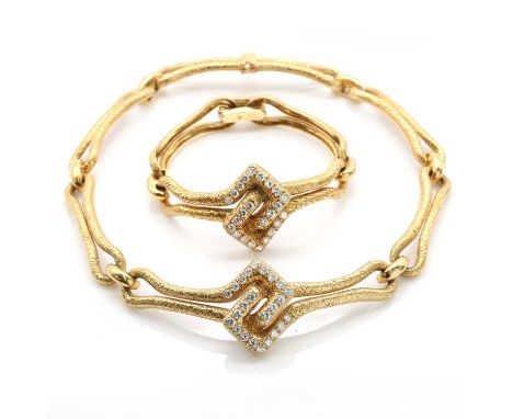 A cased 18ct gold diamond set necklace and bracelet suite, by Asprey &amp; Co. Ltd., c.1970,the necklace composed of a geomet
