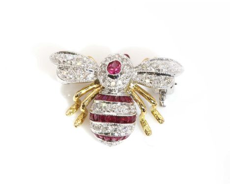 A two colour gold, ruby and diamond bee brooch, retailed by Susannah Lovis,with cabochon ruby eyes. The thorax with an oval f