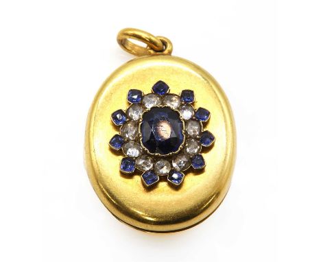 An Edwardian sapphire and diamond locket,with an oval mixed cut sapphire, spitch set to the centre. A border of rose cut diam