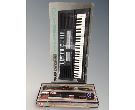 A Lima train set and a Yamaha PSF-470 electronic keyboard in box 