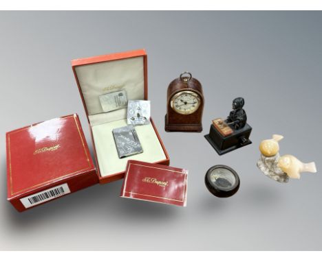 A Dupont lighter in box, Roger Lascelles quartz alarm timepiece, small wooden mechanical toy in the form of a man playing a x