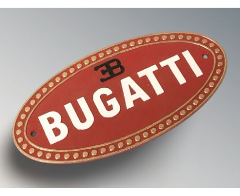 A cast iron Bugatti plaque, width 35 cm.