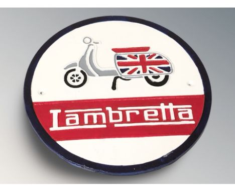 A cast iron Lambretta plaque, diameter 30 cm.