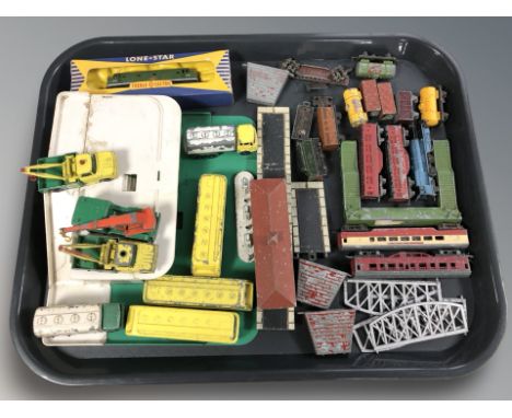 A miniature garage and group of Lesney die cast buses, tin plate rolling stock, a Lone Star 000 diesel electric locomotive in