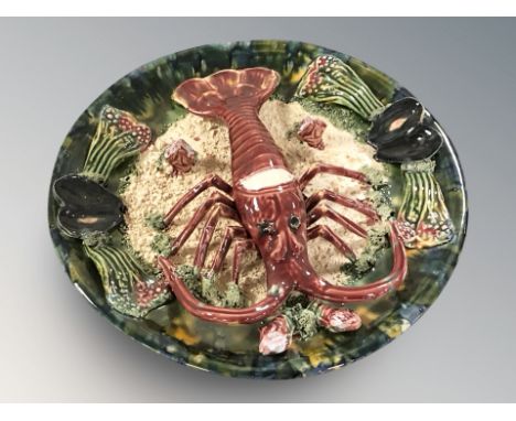 A Palissy style lobster dish, diameter 30 cm. (as found)