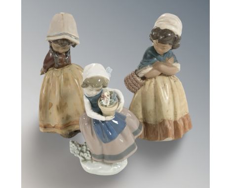 A Lladro figure of a girl carrying a flower pot and two futher matte glazed figures of girls, tallest 21 cm.
