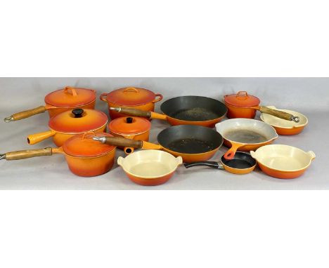 LE CREUSET COOKWARE, selection of orange enamelled cast iron pans and dishesProvenance: private collection Denbighshire