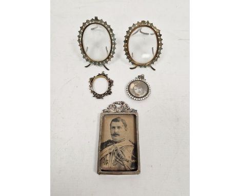 Miniature silver mounted picture frame, rectangular, 9cm high, an enamel oval floral picture frame, 4cm and three others (5)&