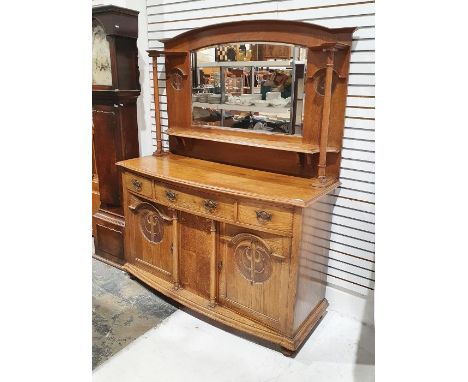 Arts and Crafts oak dresser of Scottish style with mirrored superstructure flanked by ionic columns and carved floral roundel