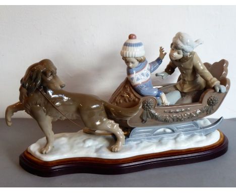 An usually large Lladró porcelain figure group, 'Sleigh Ride'. Finely hand-decorated and with impressed dark blue Lladró mark