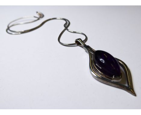 A teardrop-shaped silver pendant centrally-set with an amethyst dropper, suspended upon a silver chain (boxed)