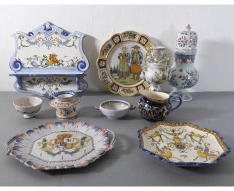 A good selection of French Quimper and&nbsp;faience pottery to include a shaped wall-mounting shelf, a large castor, various 