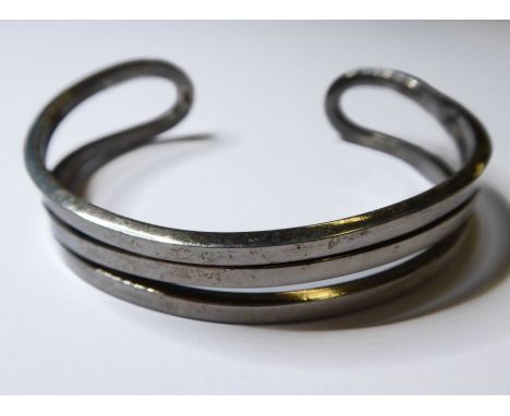 A heavy solid silver C-shaped bangle (boxed)