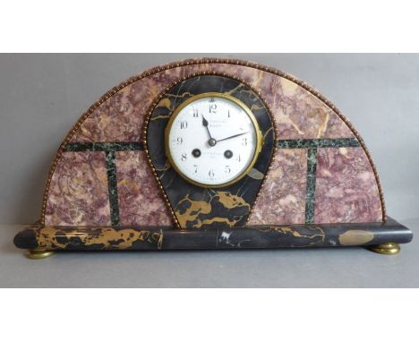 A half-moon Art Deco mantle clock in pink and black marble case, Paris maker or retailer, with key (pendulum missing)