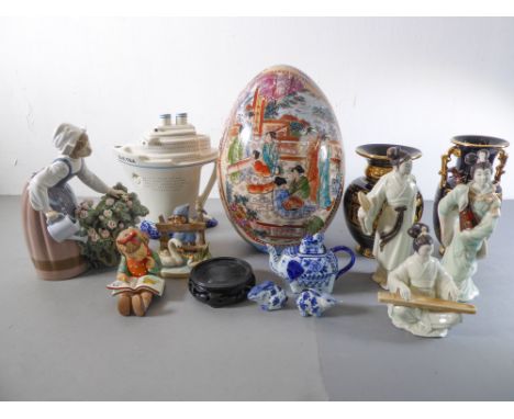 A selection of decorative and ornamental ceramics to include a large hand-decorated Chinese porcelain egg (32cm high), a&nbsp