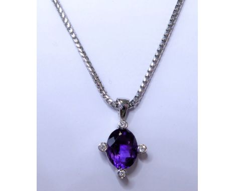 An 18-carat white-gold, amethyst and diamond pendant and chain. (The chain 45.5cm long and the pendant approx. 18mm x 10mm.)