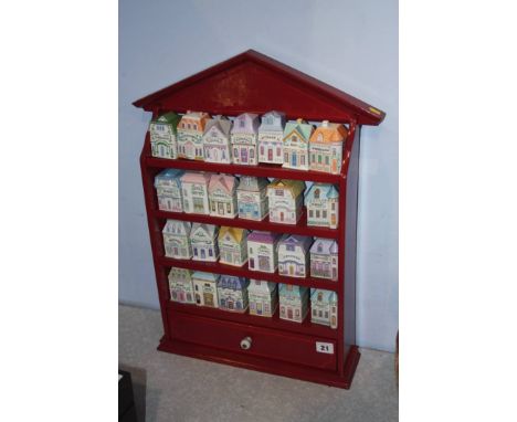 Collection of Brooks and Bentley spice pots and rack