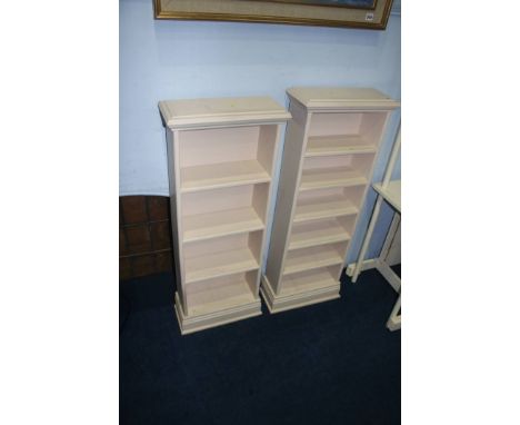 Two painted bookcases and a standard lamp