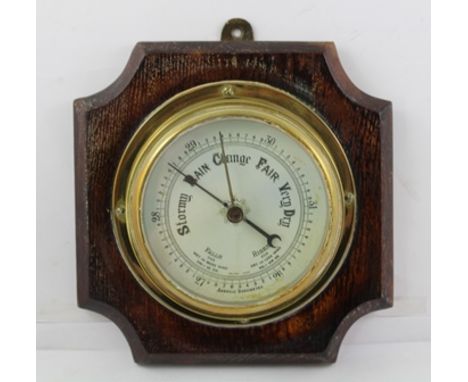 AN EARLY TO MID 20TH CENTURY BRASS CASED BINNACLE ANEROID BAROMETER, the calibrated dial inscribed "British Made", 17cm diame