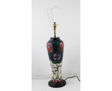 A LATE 20TH CENTURY MOORCROFT SLENDER BALUSTER FORM TABLE LAMP BASE, having a Mackintosh inspired design with tube lined and 