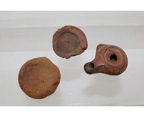 AN ANCIENT EGYPTIAN SMALL TERRACOTTA OIL LAMP, believed to be Roman Period 4th/5th century A.D., 4.5cm, together with two sma