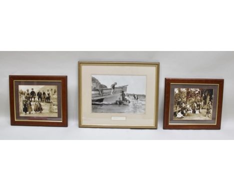 A PAIR OF EARLY 20TH CENTURY PHOTOGRAPHIC PRINTS FROM 19TH CENTURY PLATES, depicting poor children in a gateway and washing t