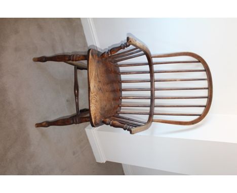 A 19TH CENTURY STICK BACK OPEN ARM KITCHEN CHAIR, having elm seat, on ring turned supports with H-stretcher 