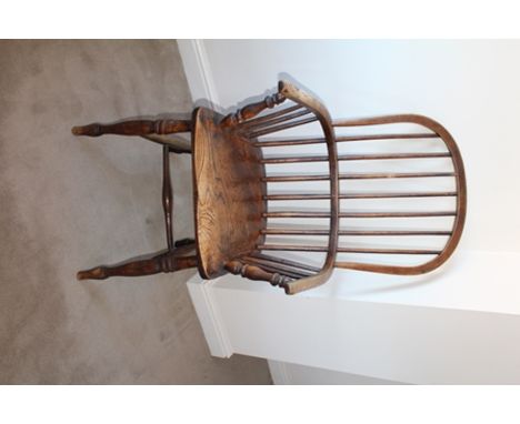 A 19TH CENTURY STICK BACK OPEN ARM KITCHEN CHAIR, having elm seat, on ring turned supports with H-stretcher 