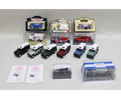 SIX DIE-CAST MODELS OF LANDROVER DEFENDER LWB STATION WAGONS, Oxford Road Show Bedford van in acrylic packaging, an Oxford Ra