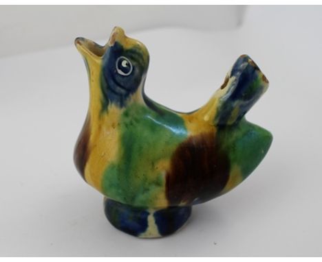 AN ENGLISH 19TH CENTURY WHIELDON WARE GLAZED CERAMIC BIRD FORM WHISTLE, coloured in blue, green, brown and yellow, 8cm high 