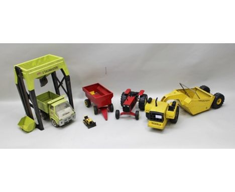 TONKA TOYS including; red tin-plate tractor and trailer, an earth scraper, a Tonka loadmaster loading system with hydraulic t