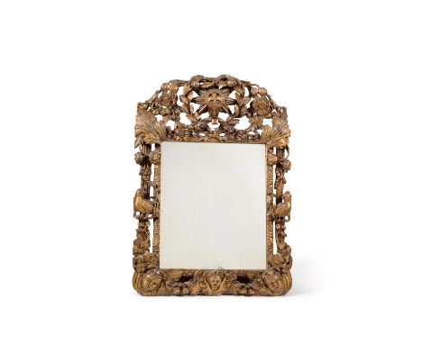 A William & Mary carved giltwood wall mirror, circa 1690, the pierced frame incorporating putti, flowers and birds, the surmo