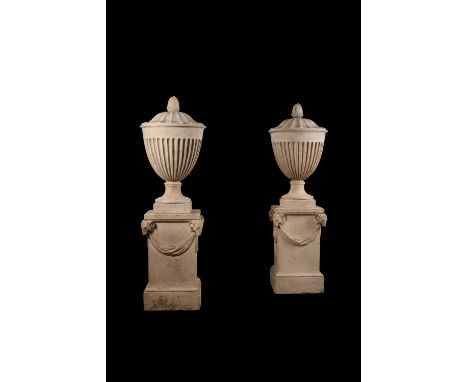 A pair of fine George III artificial 'Coade Stone' urn finials, late 18th century, stamped for Coade, Lambeth, the fluted ovo