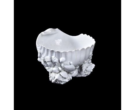 A Bow white porcelain shell-salt, circa 1752, modelled with shell-encrusted base, incised arrow and annulet mark, 14.5cm wide