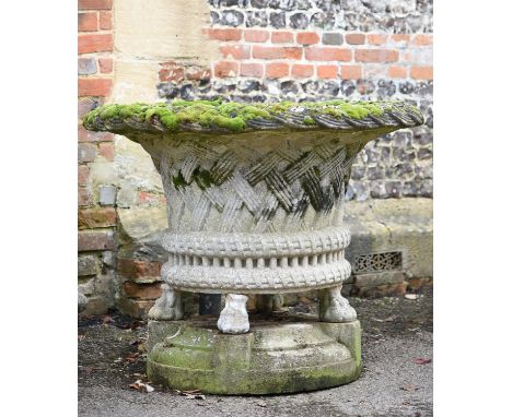 An oversized stone composition jardiniere, in the manner of designs by Austin and Seeley, late 19th or 20th century, in the f