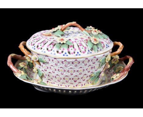 A Worcester polychrome chesnut basket, cover and stand, circa 1770, pierced and applied with flowers and with crabstock handl