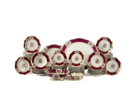 A Chamberlain's Worcester claret-ground armorial part dinner service, mid 19th century, decorated with elaborate arms surmoun