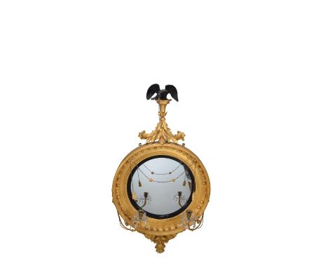 A Regency giltwood convex wall mirror, by Thomas Fentham, circa 1815, bearing an applied fragmentary label for the maker ' TH