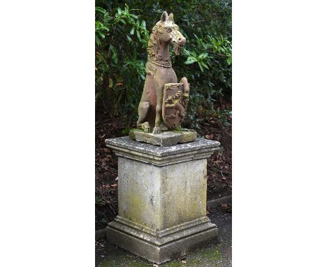 An English red stoneware model of a heraldic horse, 20th century or possibly earlier, portrayed sejant, with a coronet around