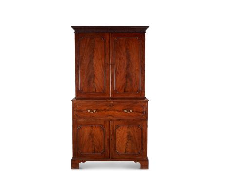 A George III mahogany secretaire cabinet, circa 1785, attributed to Gillows, the interior of the secretaire drawer being shap