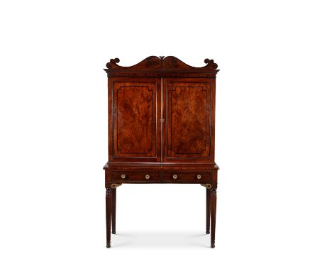 A Regency figured mahogany and ebony inlaid secretaire cabinet, circa 1815, in the manner of George Bullock, 195cm high, 114c