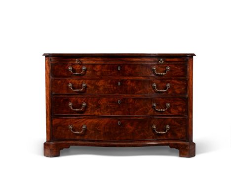 A George III mahogany serpentine fronted commode, circa 1775, one drawer bearing a retail label for 'NORMAN ADAMS LTD, 8-10, 
