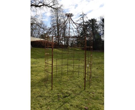 A wrought iron arbour, probably English, 19th century, of domed circular form and latticed construction, terminating in a scr