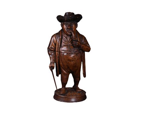 An English or North European sculpted softwood figural tobacco jar, 19th century, modelled as a rotund gentleman smoking a pi