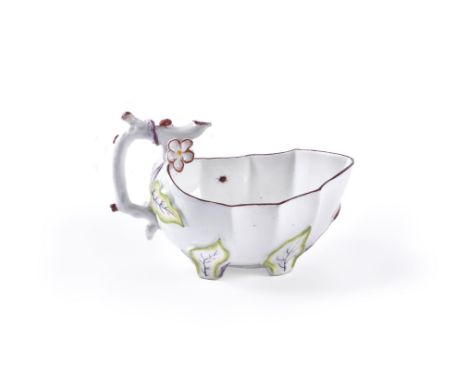 A Chelsea leaf-shaped polychrome sauce boat, circa 1760, moulded in relief with leaves and flowers and painted with scattered