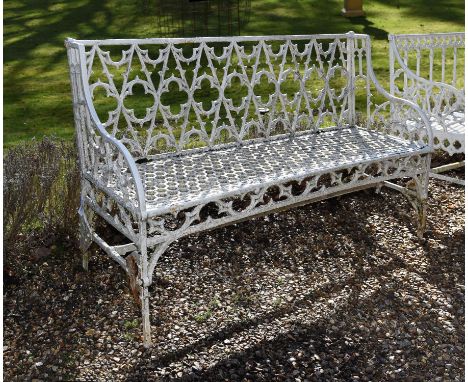 A French white painted cast iron Gothic Revival garden bench, attributed to the Val d'Osne foundry, late 19th century, the op