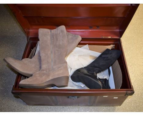 An early 20th Century tin trunk containing a pair of Norm Thompson ladies boots, size 7, boxed; another pair, Richard Draper