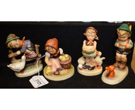 A collection of four Goebel Hummel figures