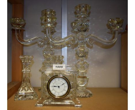 A Waterford Crystal glass mantel clock; others, a pair of candlesticks; a pair of cut glass three branch candelabra (5)